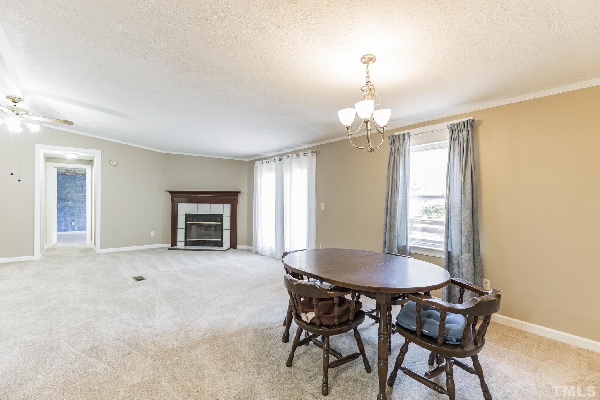290 Thomas Cash Road Apex, NC 27523 - Photo 16 of 40 a dining room with furniture and window
