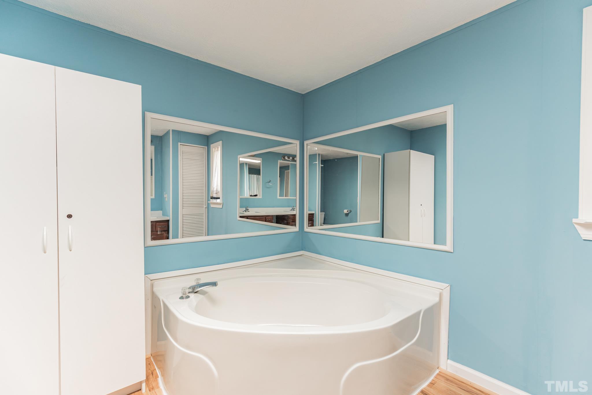 290 Thomas Cash Road Apex, NC 27523 - Photo 22 of 40 a white bath tub sitting in a bathroom