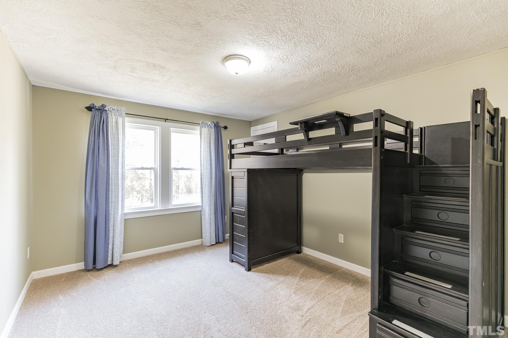 290 Thomas Cash Road Apex, NC 27523 - Photo 23 of 40 a view of an empty room and window
