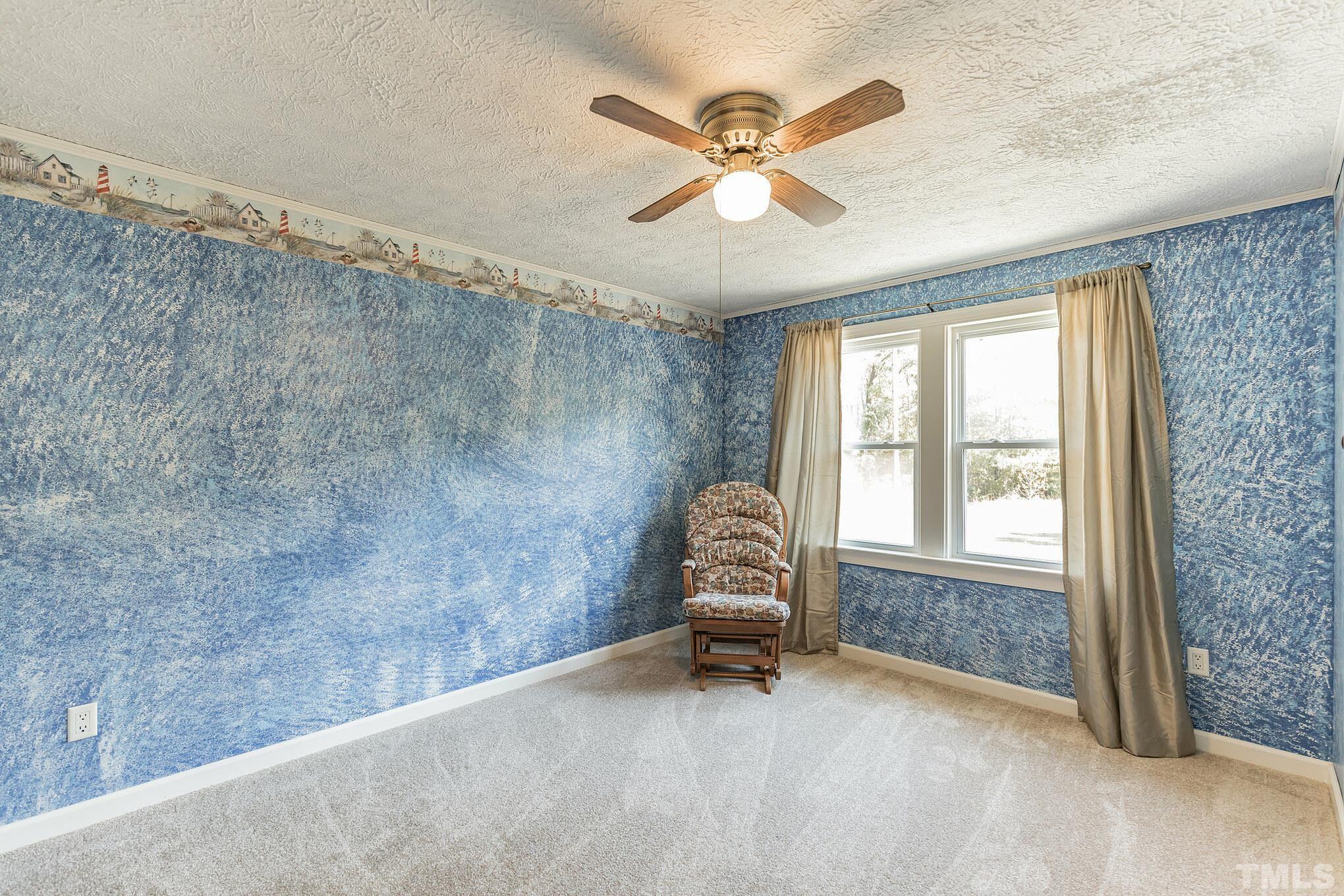 290 Thomas Cash Road Apex, NC 27523 - Photo 24 of 40 a living room with furniture and a window