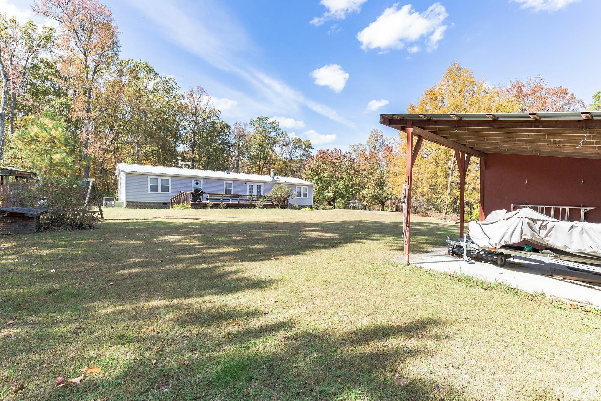 290 Thomas Cash Road Apex, NC 27523 - Photo 28 of 40 a view of a balcony with a stove