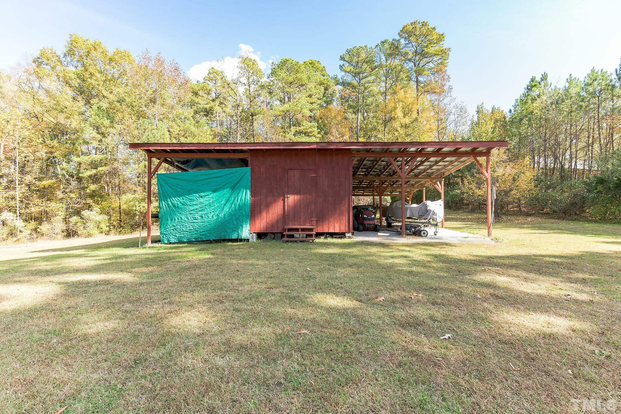 290 Thomas Cash Road Apex, NC 27523 - Photo 31 of 40 a front view of a house with garden