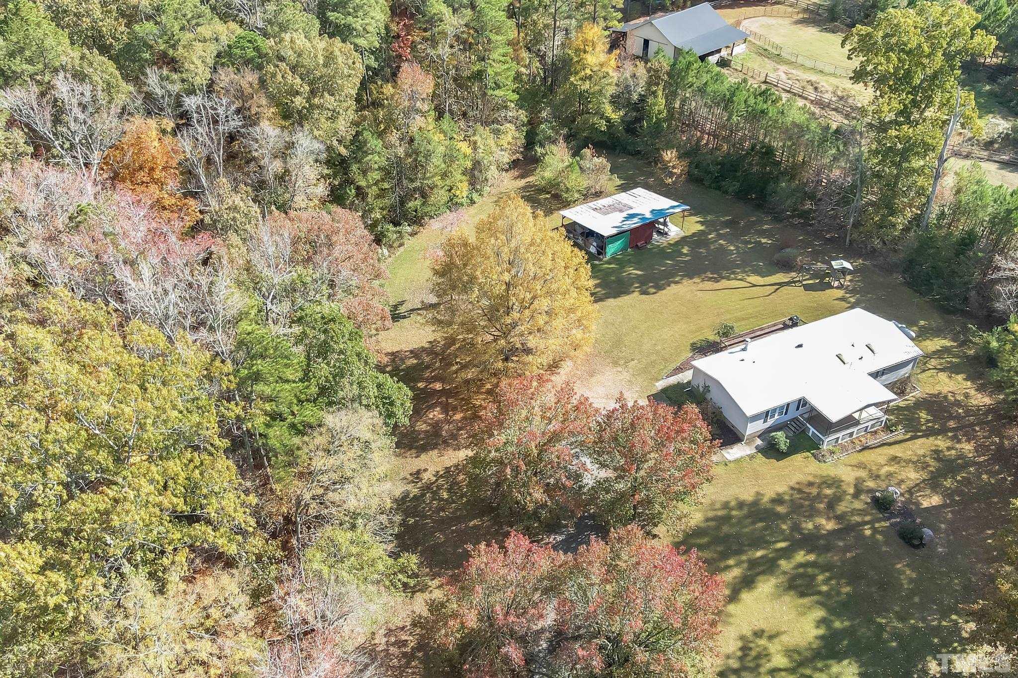290 Thomas Cash Road Apex, NC 27523 - Photo 4 of 40 a backyard of a house with lots of green space