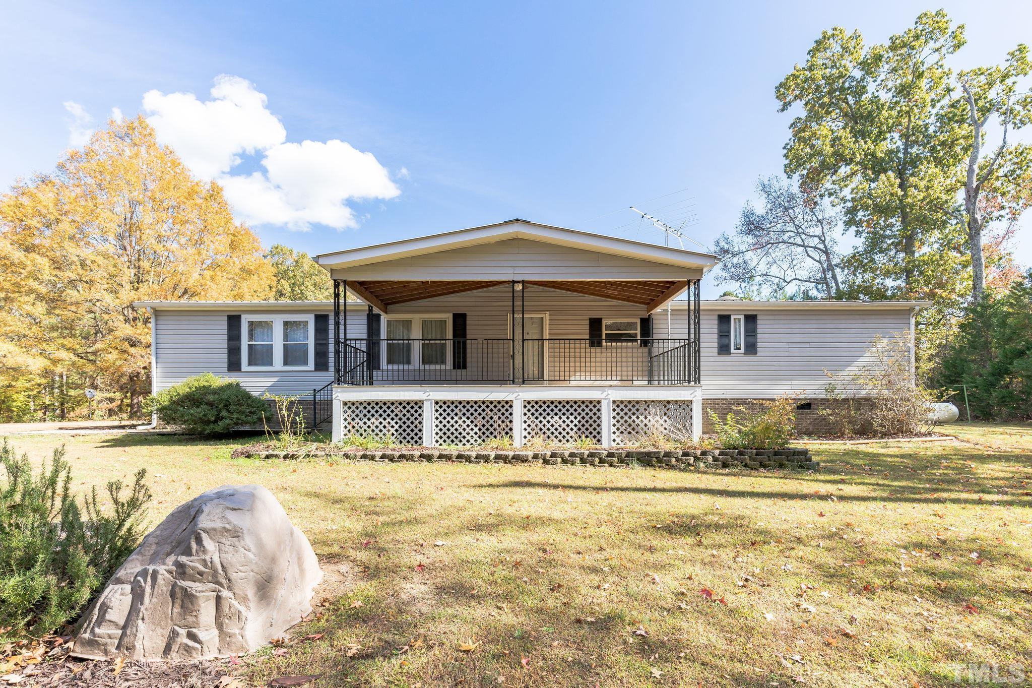 290 Thomas Cash Road Apex, NC 27523 - Photo 7 of 40 a front view of a house with a yard