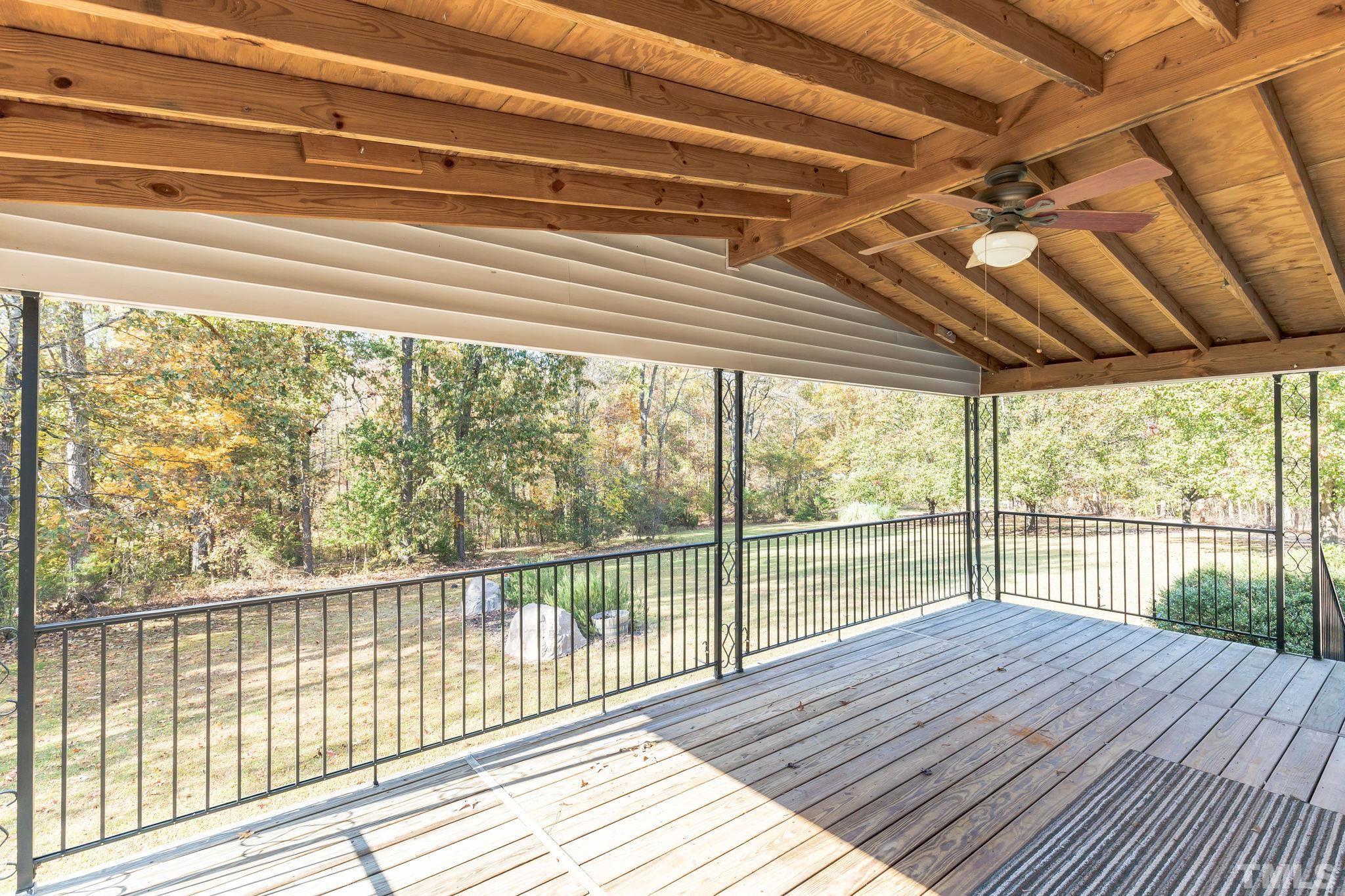 290 Thomas Cash Road Apex, NC 27523 - Photo 9 of 40 a view of a wooden deck