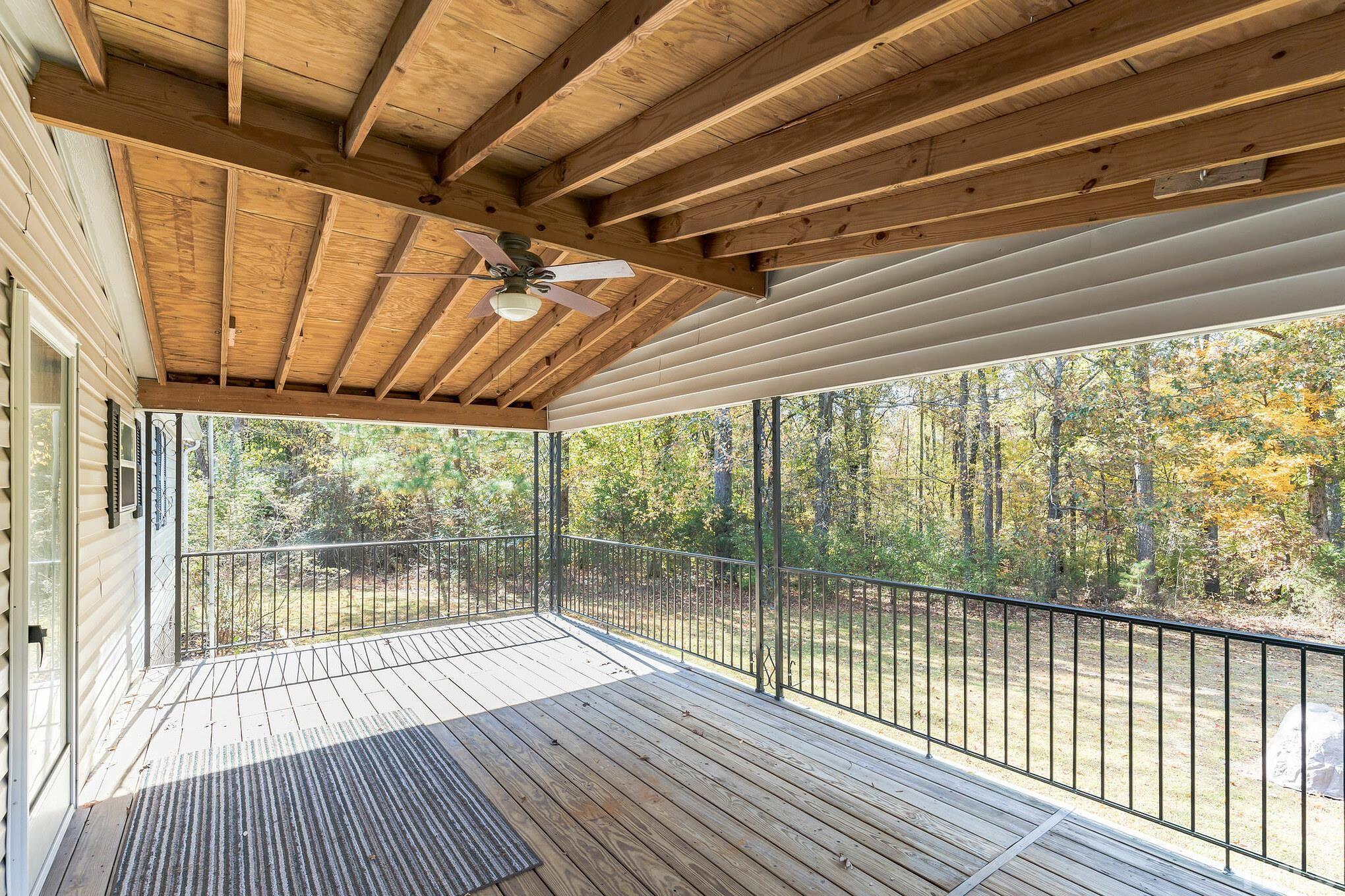 290 Thomas Cash Road Apex, NC 27523 - Photo 10 of 40 a view of a balcony with wooden floor