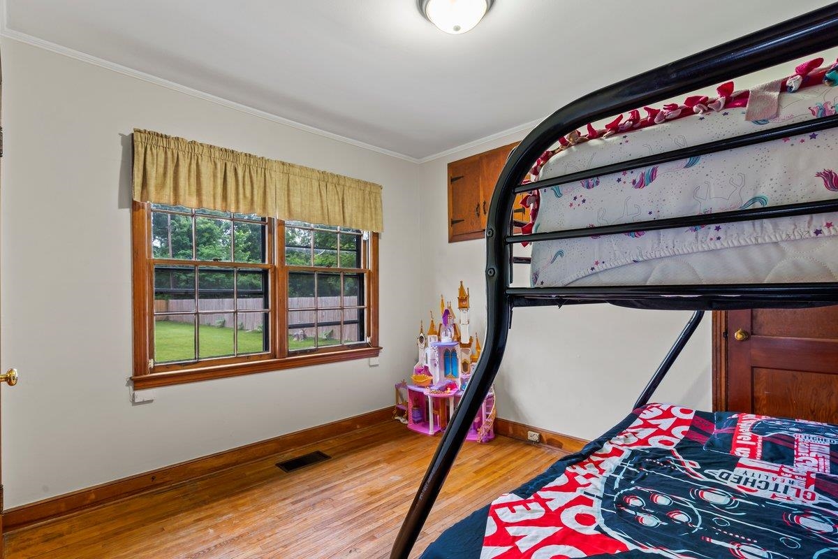 4740 Lynn Road Memphis, TN 38122 - Photo 11 of 25 a bed room with a bed and a window