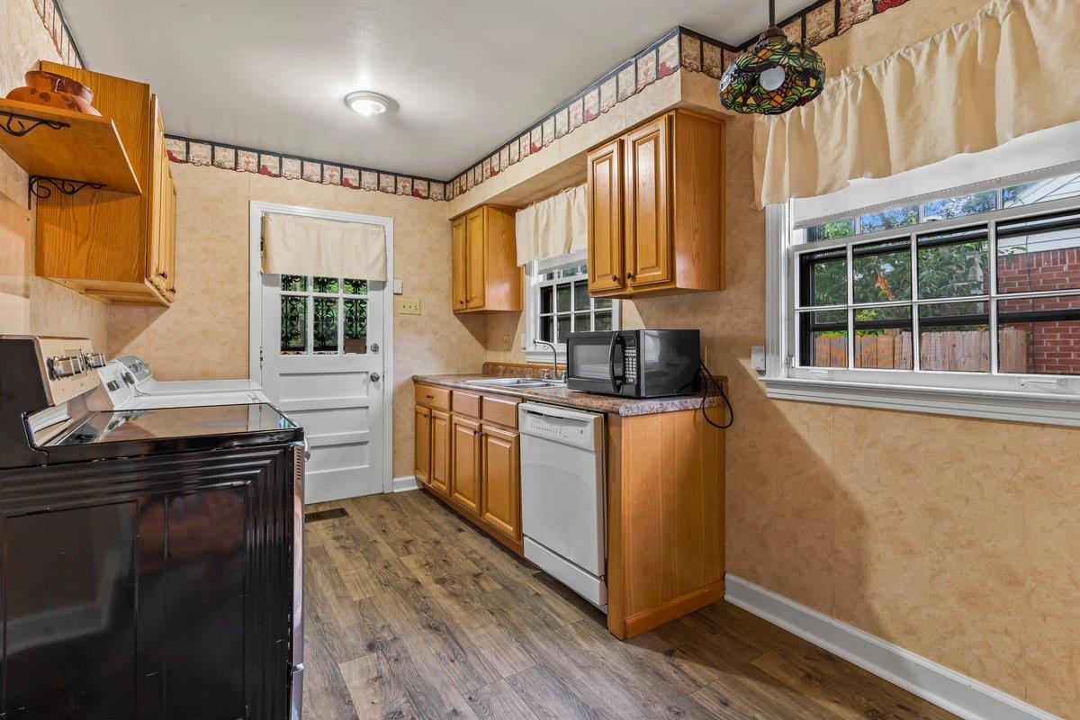 4740 Lynn Road Memphis, TN 38122 - Photo 18 of 25 a kitchen with sink cabinets and wooden floor