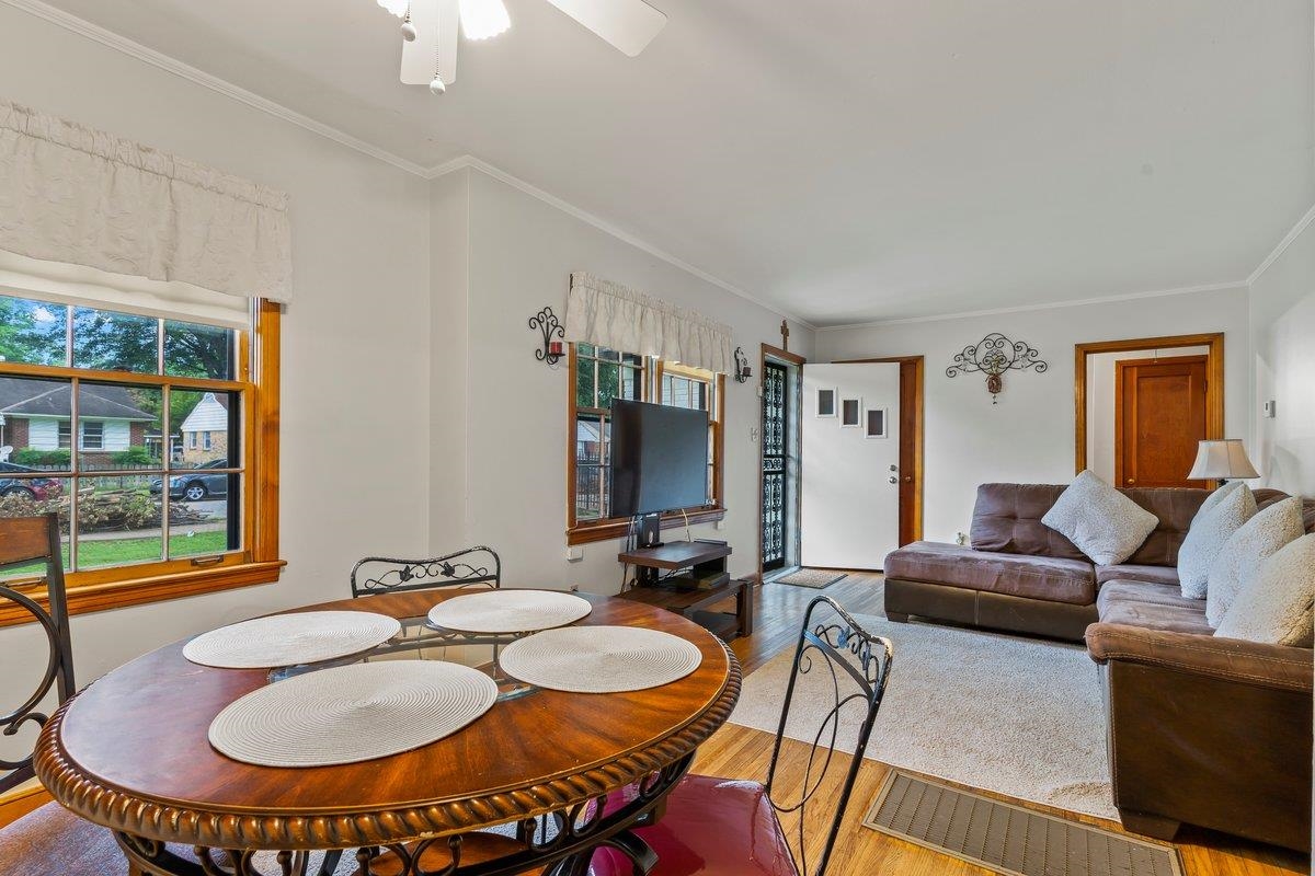 4740 Lynn Road Memphis, TN 38122 - Photo 20 of 25 a living room with furniture a large window and a chandelier