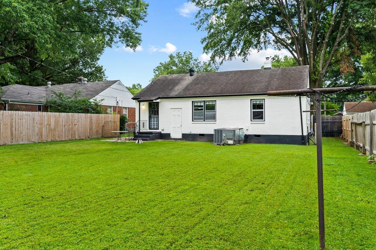 4740 Lynn Road Memphis, TN 38122 - Photo 24 of 25 a front view of a house with a garden and yard