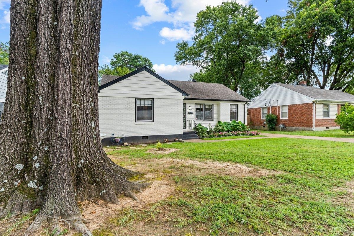 4740 Lynn Road Memphis, TN 38122 - Photo 3 of 25 a view of an house with backyard space and garden