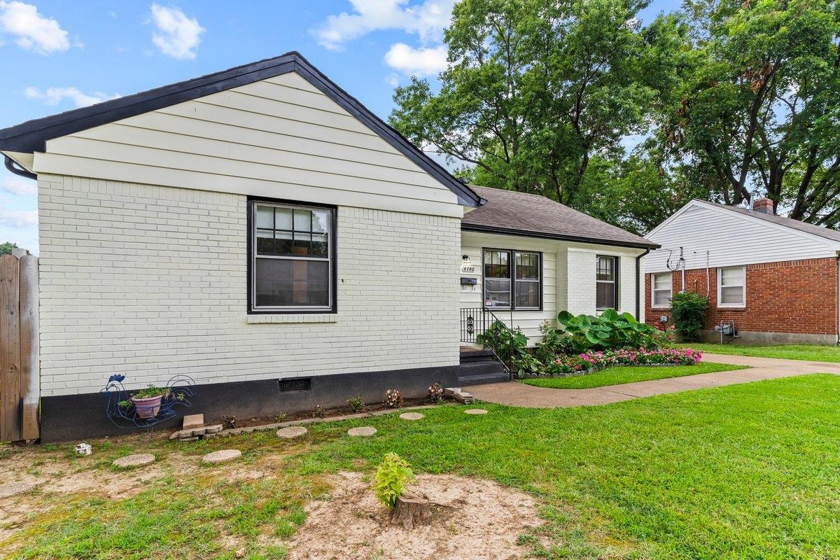 4740 Lynn Road Memphis, TN 38122 - Photo 6 of 25 a front view of a house with a yard