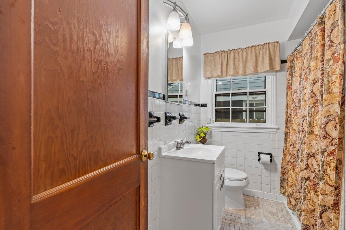 4740 Lynn Road Memphis, TN 38122 - Photo 7 of 25 a bathroom with a sink toilet and shower