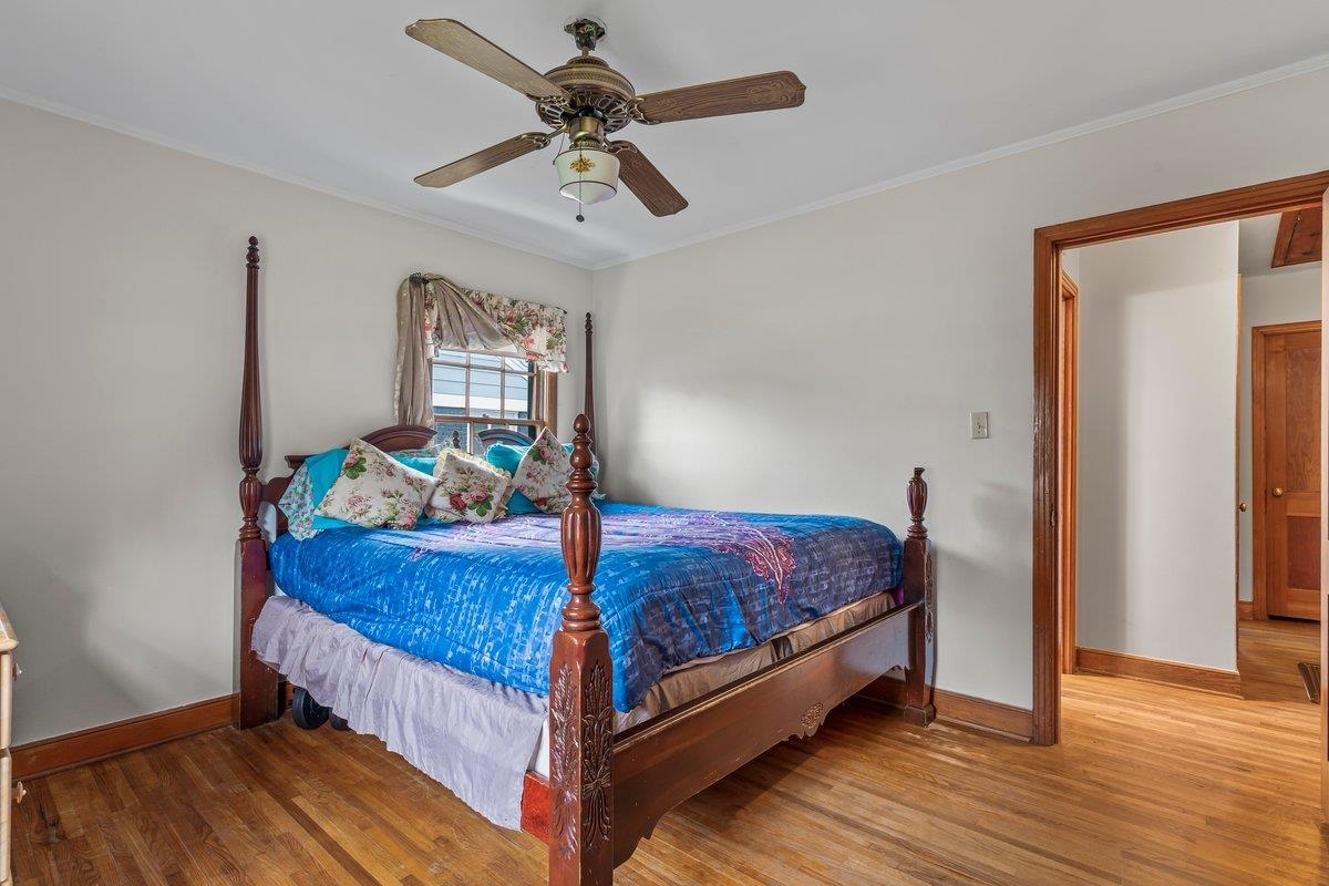 4740 Lynn Road Memphis, TN 38122 - Photo 8 of 25 a bed sitting in a bedroom next to a window