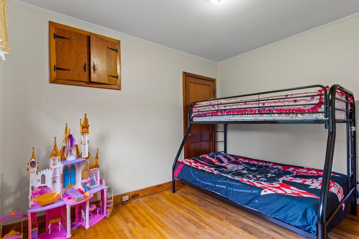 4740 Lynn Road Memphis, TN 38122 - Photo 10 of 25 a bedroom with baby bed and a baby crib