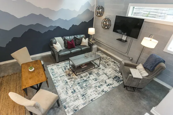 a living room with furniture and a flat screen tv