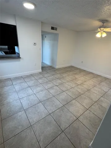 a view of a livingroom with furniture and flat screen tv