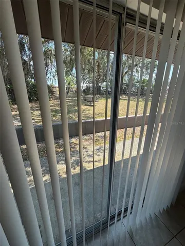 a view of outdoor space with balcony and furniture