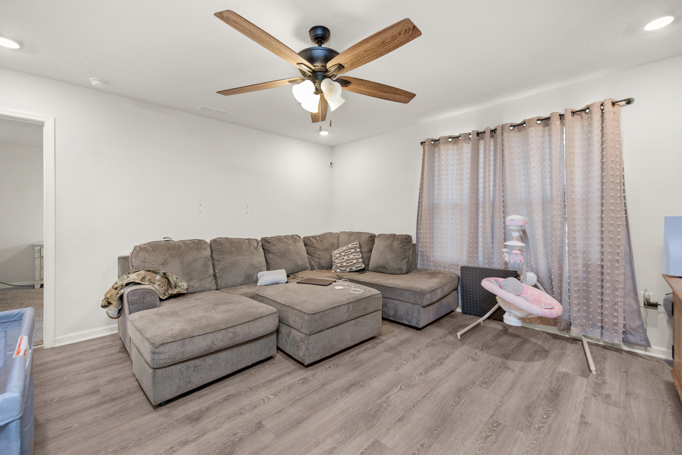 4662 Honor Guard Way Crestview, FL 32539 - Photo 2 of 10 a living room with furniture and a ceiling fan
