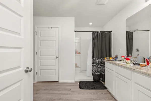 a kitchen with a sink and refrigerator