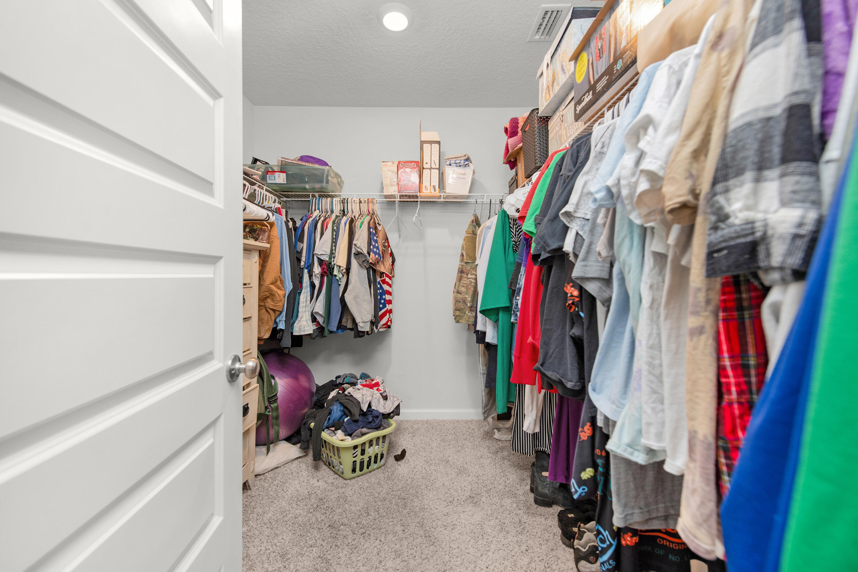 4662 Honor Guard Way Crestview, FL 32539 - Photo 8 of 10 a view of walk in closet with clothes