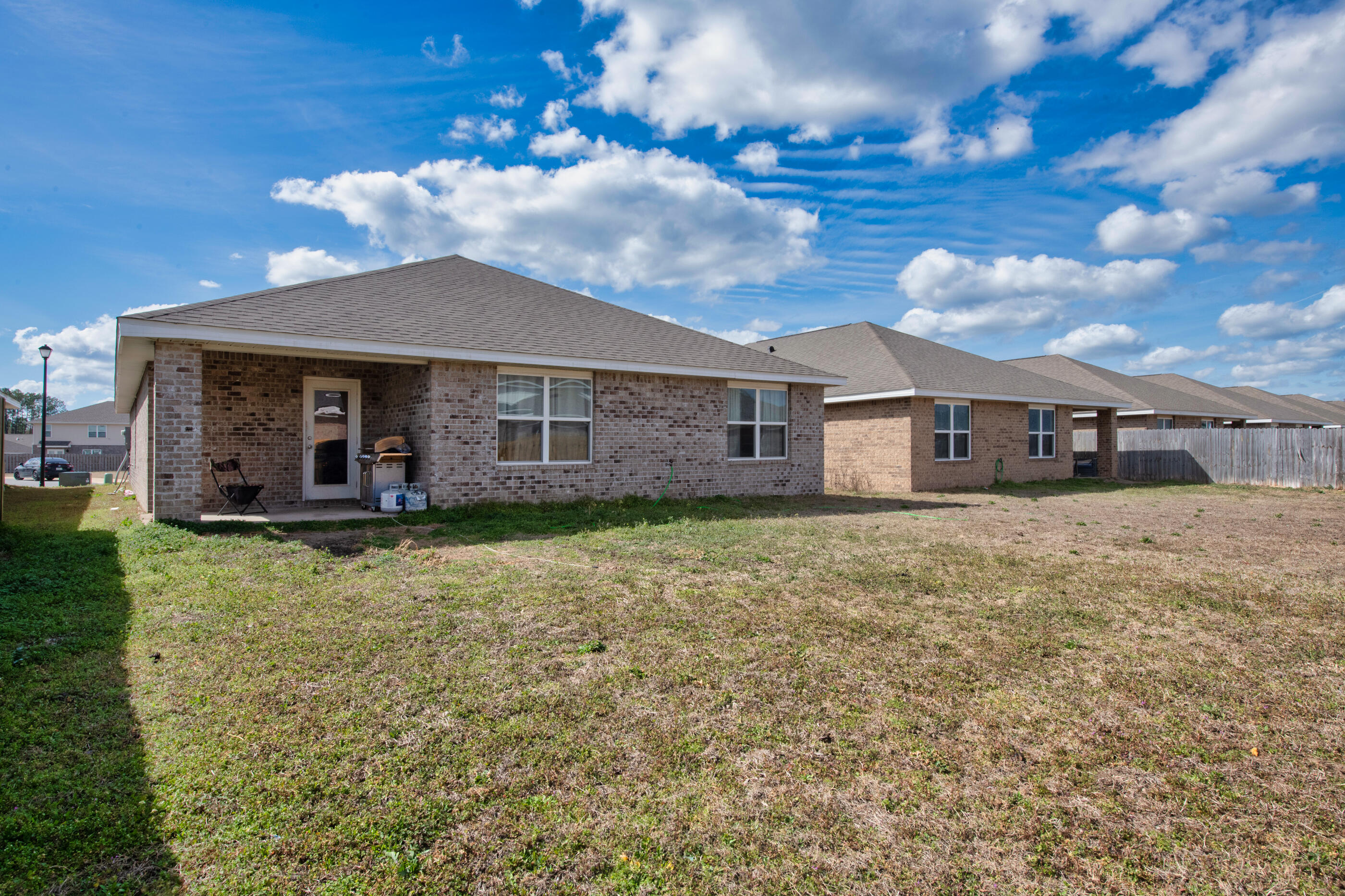 4662 Honor Guard Way Crestview, FL 32539 - Photo 10 of 10 a front view of a house with a garden