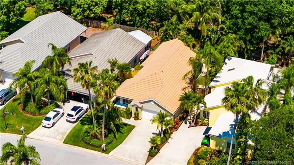 an aerial view of residential house with outdoor space and trees