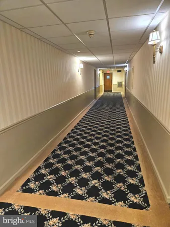 a bathroom with a black white checkered floor