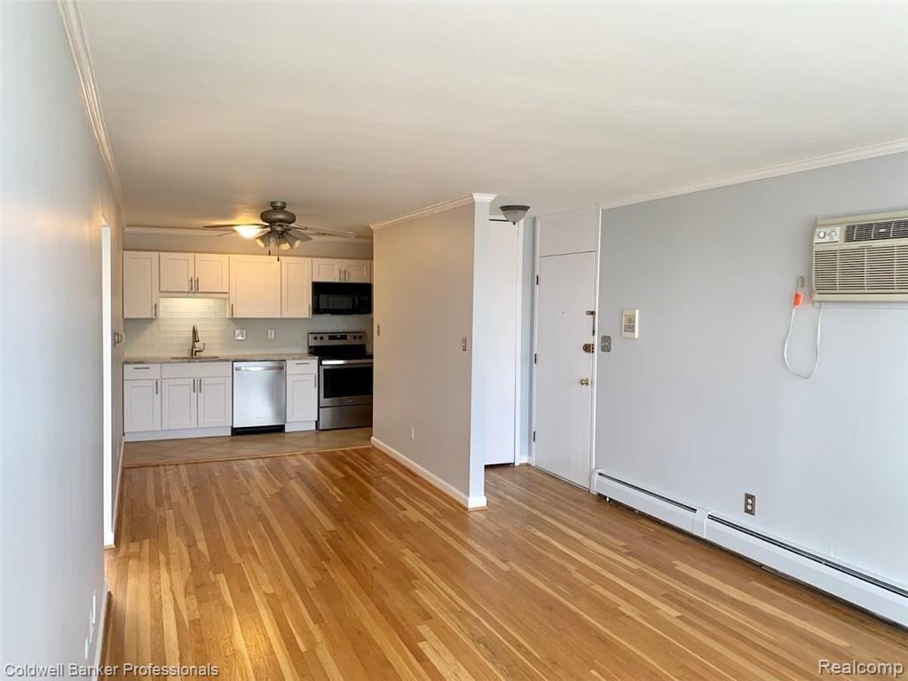 125 East 14 Mile Road, Unit 11 Birmingham, MI 48009 - Photo 2 of 17 Living Room & Kitchen