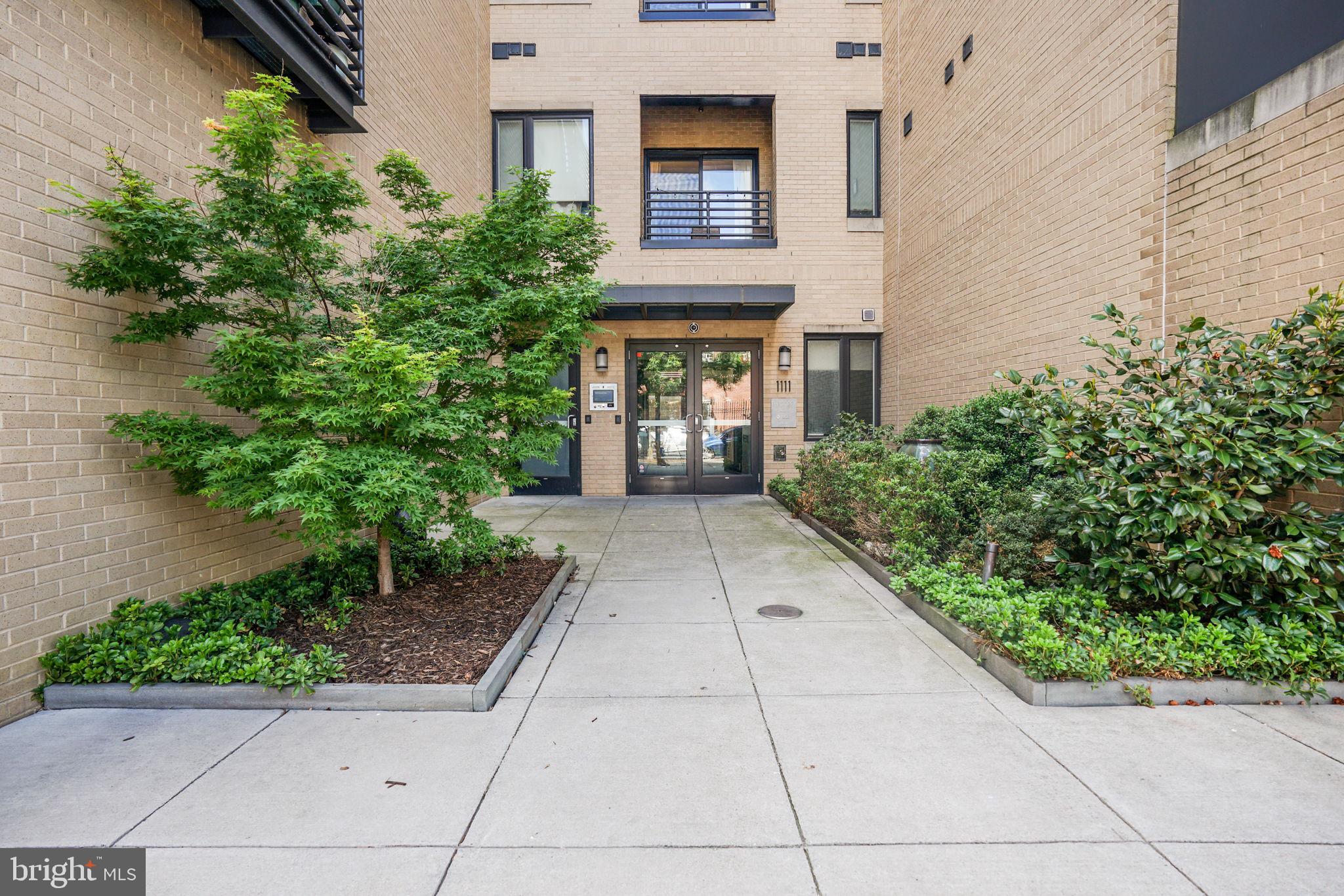 1111 Orren Street Northeast, Unit 310 Washington, DC 20002 - Photo 1 of 26 front view of a house with a porch