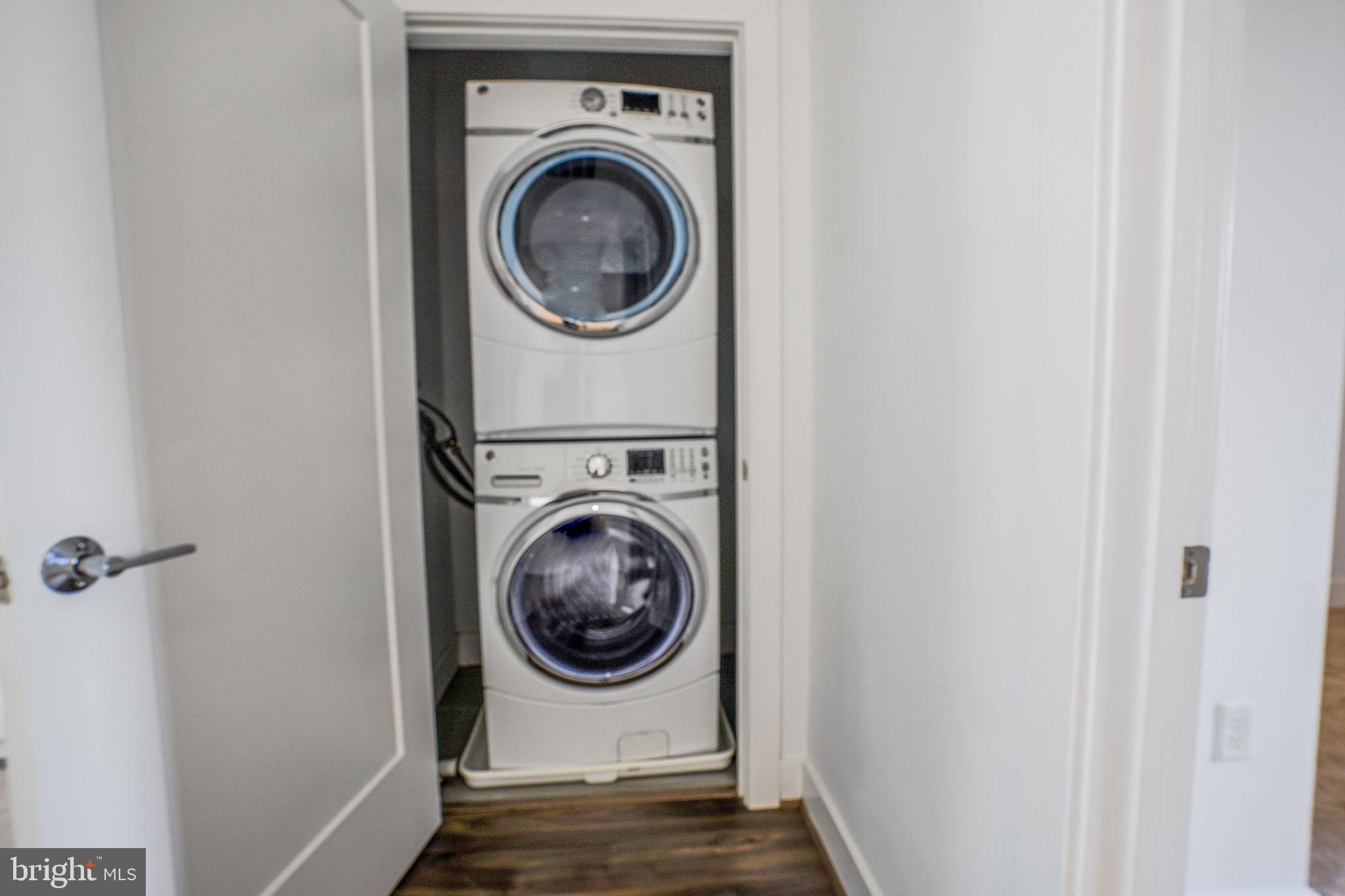 1111 Orren Street Northeast, Unit 310 Washington, DC 20002 - Photo 14 of 26 a utility room with dryer and washer