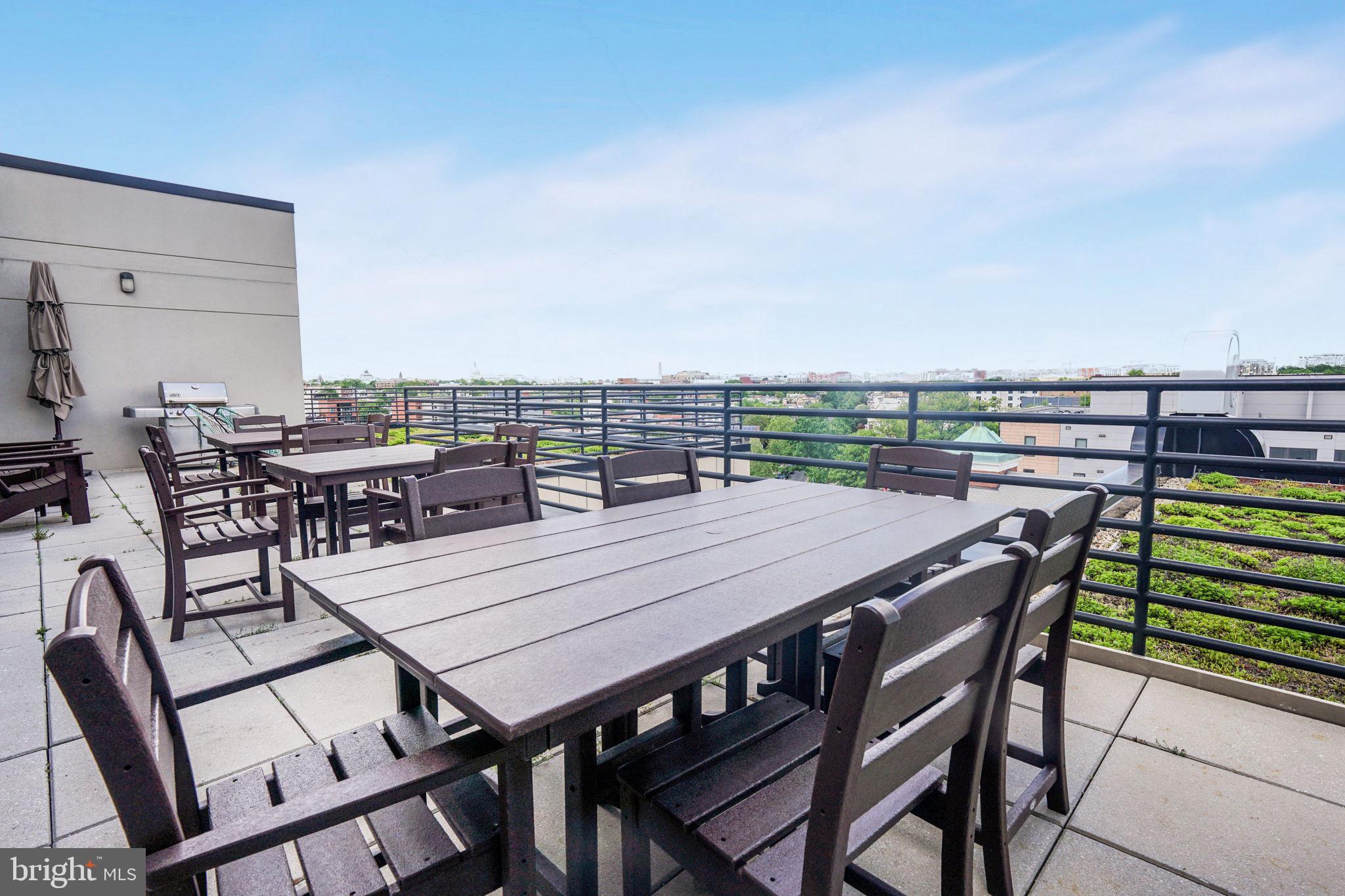 1111 Orren Street Northeast, Unit 310 Washington, DC 20002 - Photo 18 of 26 a view of a dinning table and chairs in patio