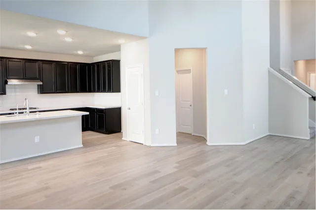 a view of kitchen with wooden floor
