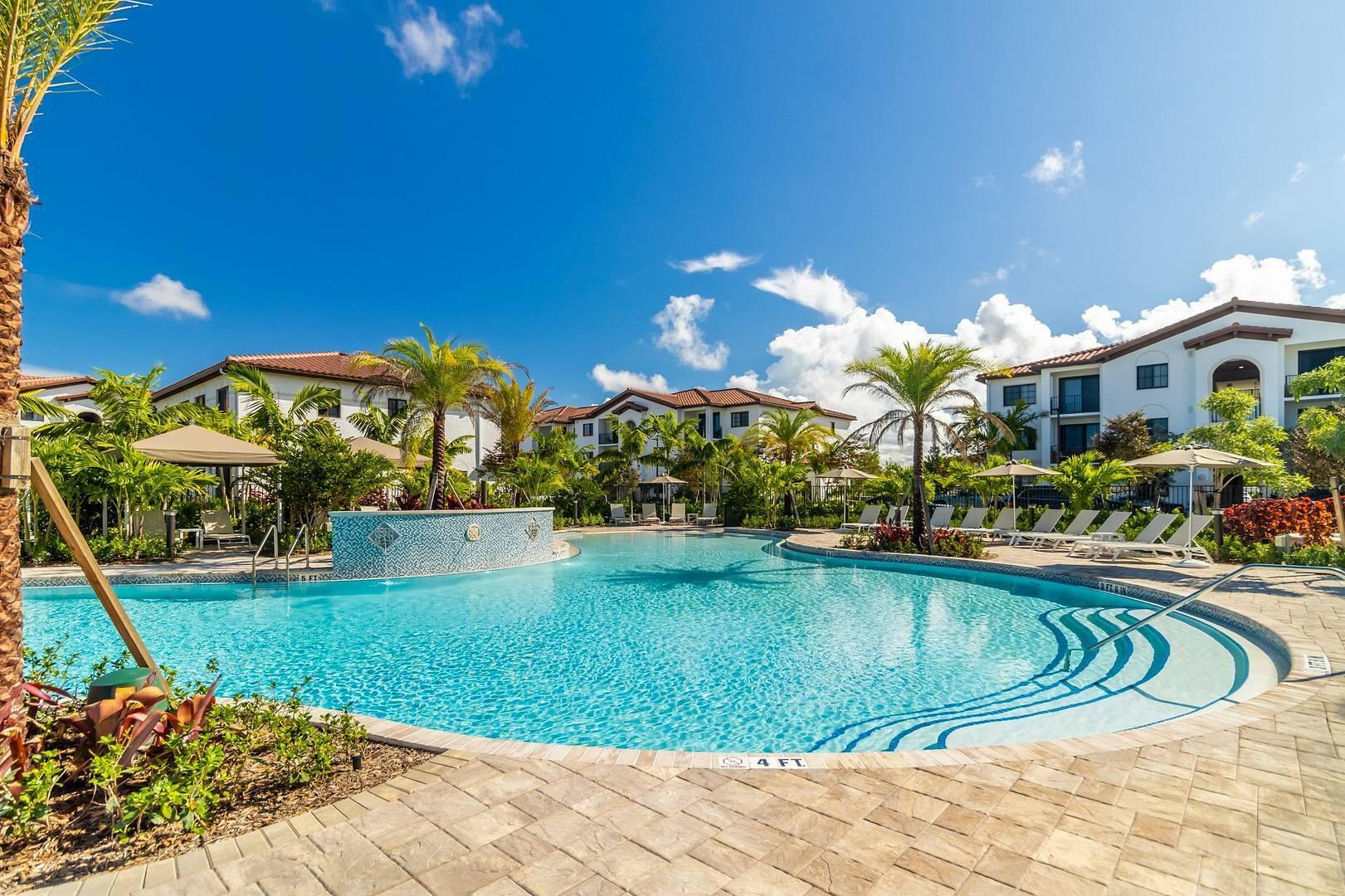 11270 Channing Way, Unit 104 Royal Palm Beach, FL 33414 - Photo 14 of 24 a view of a house with swimming pool and yard