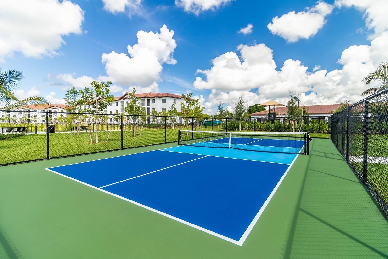11270 Channing Way, Unit 104 Royal Palm Beach, FL 33414 - Photo 19 of 24 a view of a tennis court