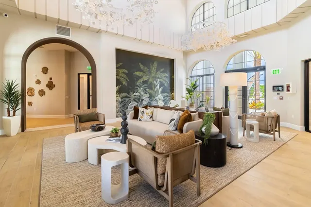 a living room with fireplace furniture and a flat screen tv