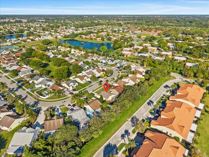 an aerial view of residential houses with outdoor space