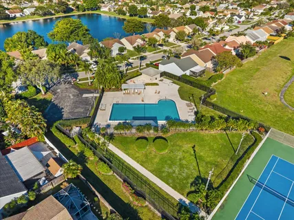 an aerial view of a residential houses with outdoor space