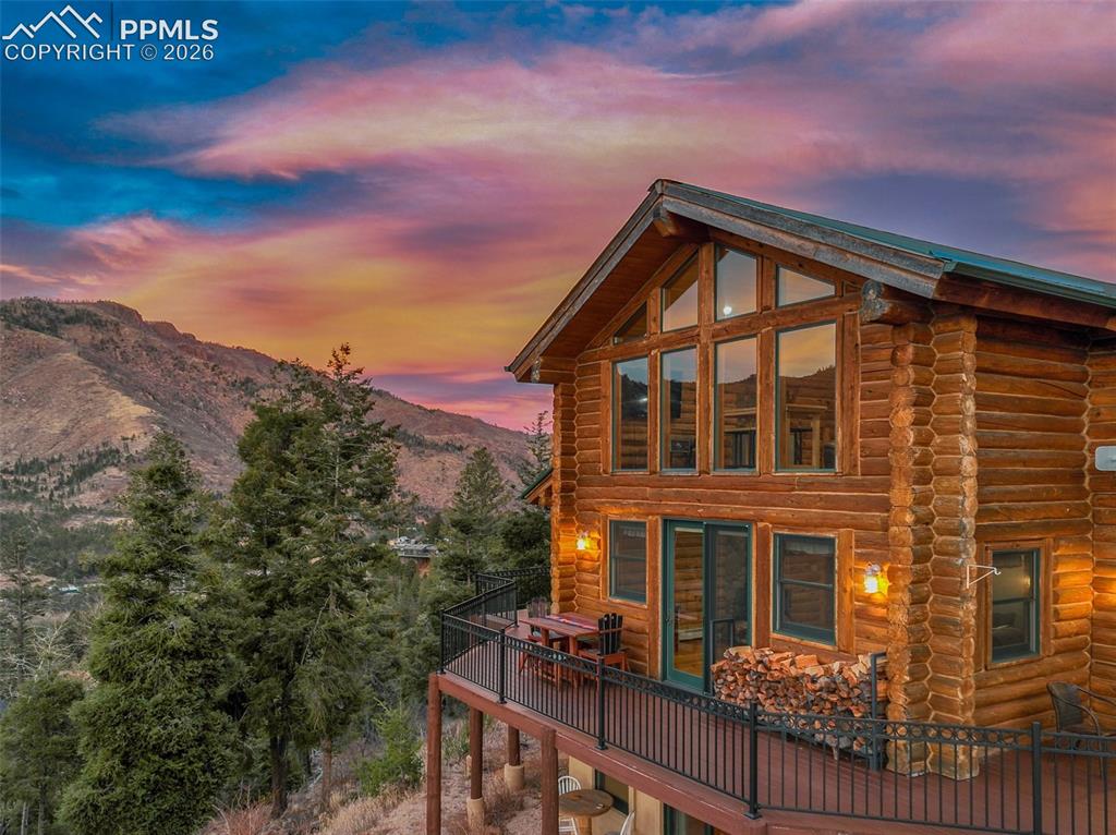 9110 Mountain Road Cascade, CO 80809 - Photo 47 of 49 a front view of a house with a yard