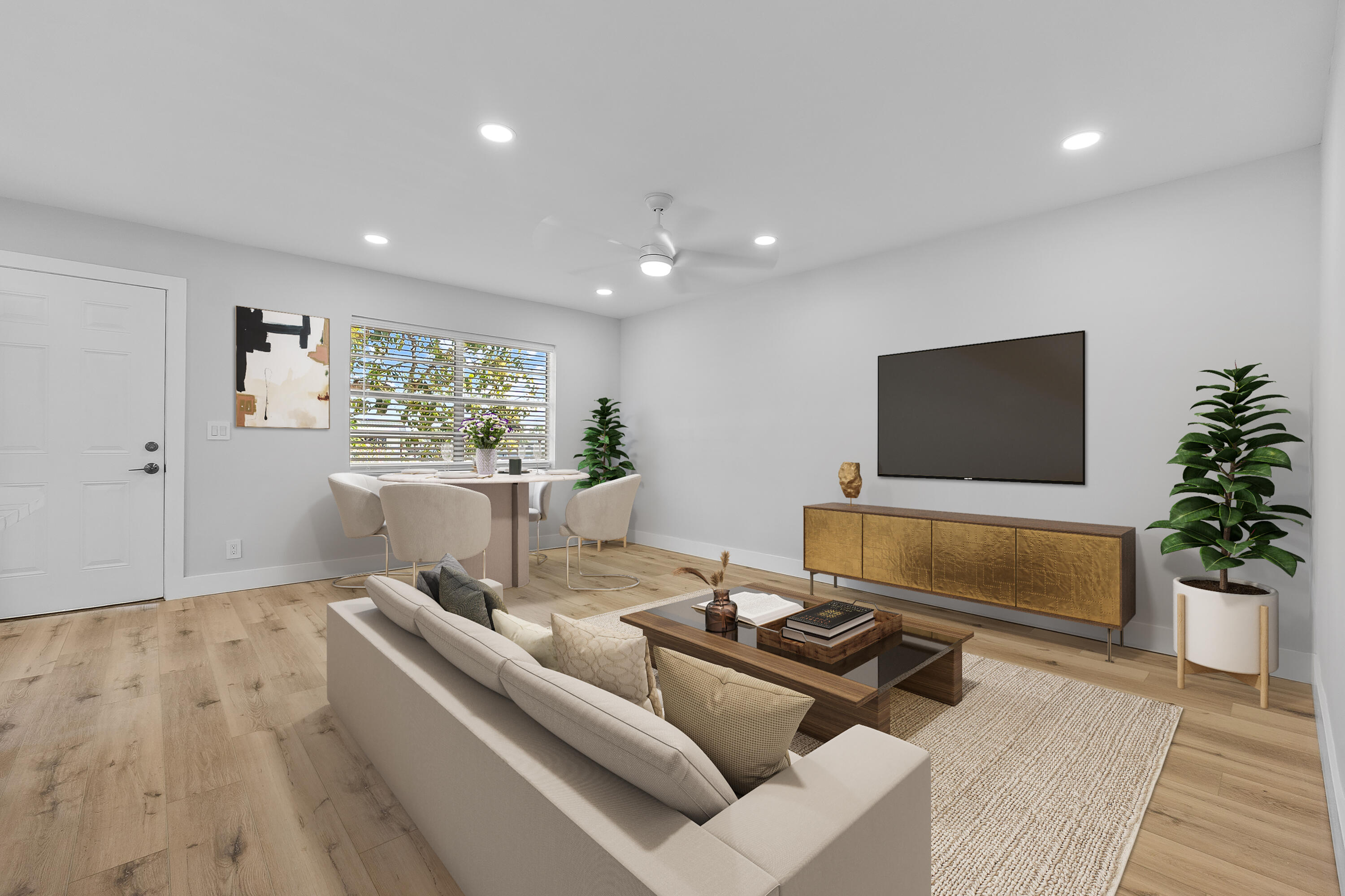 314 Monaco Boulevard, Unit G Delray Beach, FL 33446 - Photo 2 of 26 a living room with furniture and a flat screen tv