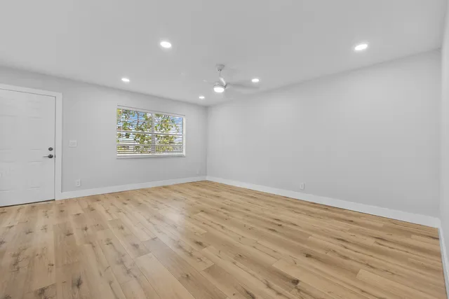 a view of an empty room and a window