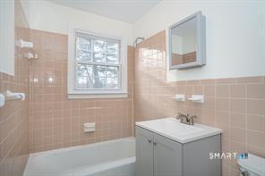 3 Brickyard Road, Unit 17B Farmington, CT 06032 - Photo 9 of 13 a bathroom with a sink a toilet and shower