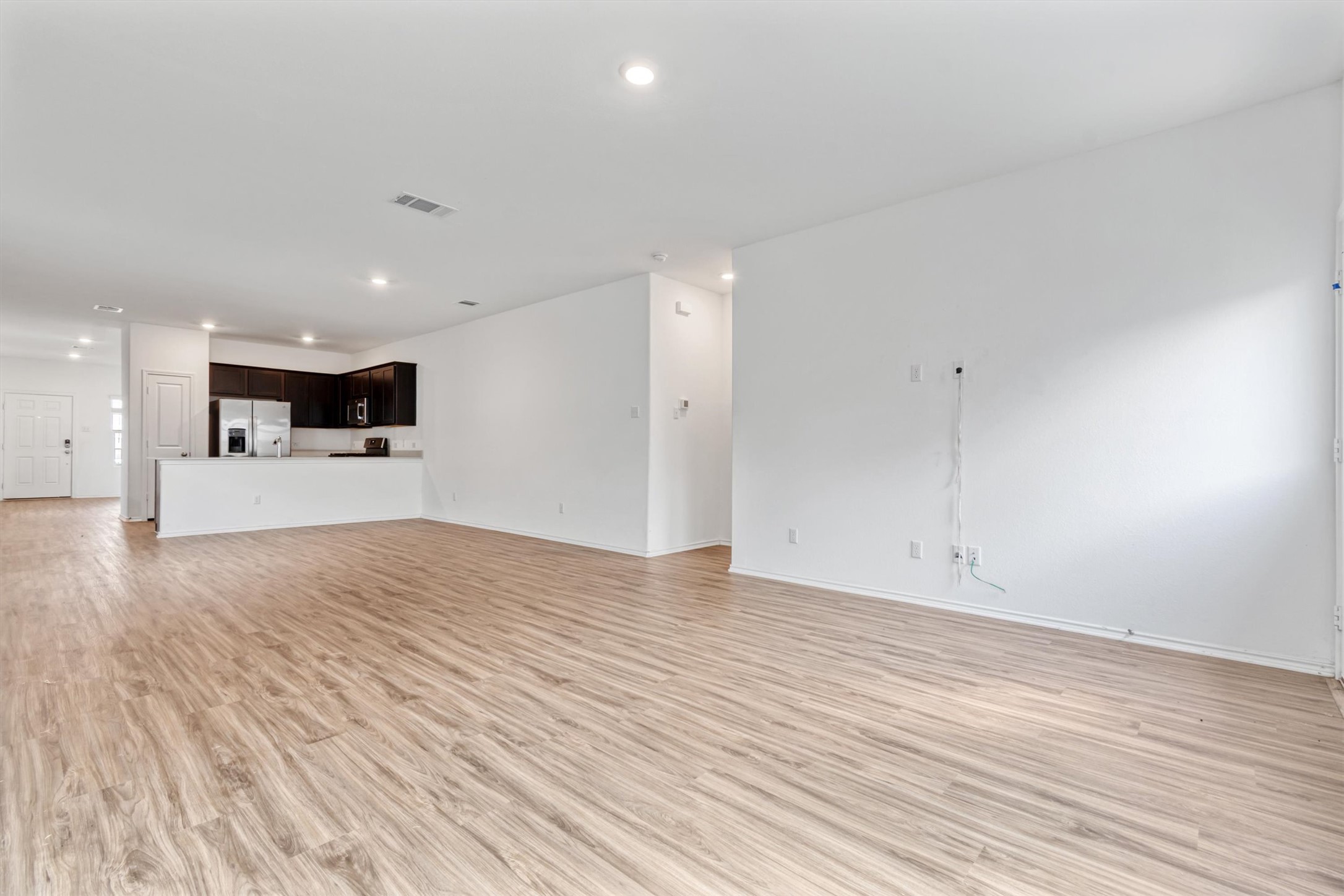 417 Soapstone Pass Maxwell, TX 78656 - Photo 6 of 18 a view of a kitchen with a sink and a stove top oven