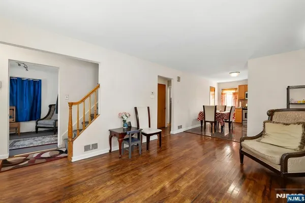 a kitchen with stainless steel appliances granite countertop a refrigerator stove top oven and sink