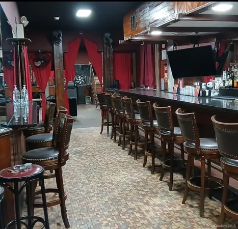 a view of a chairs and tables in a patio