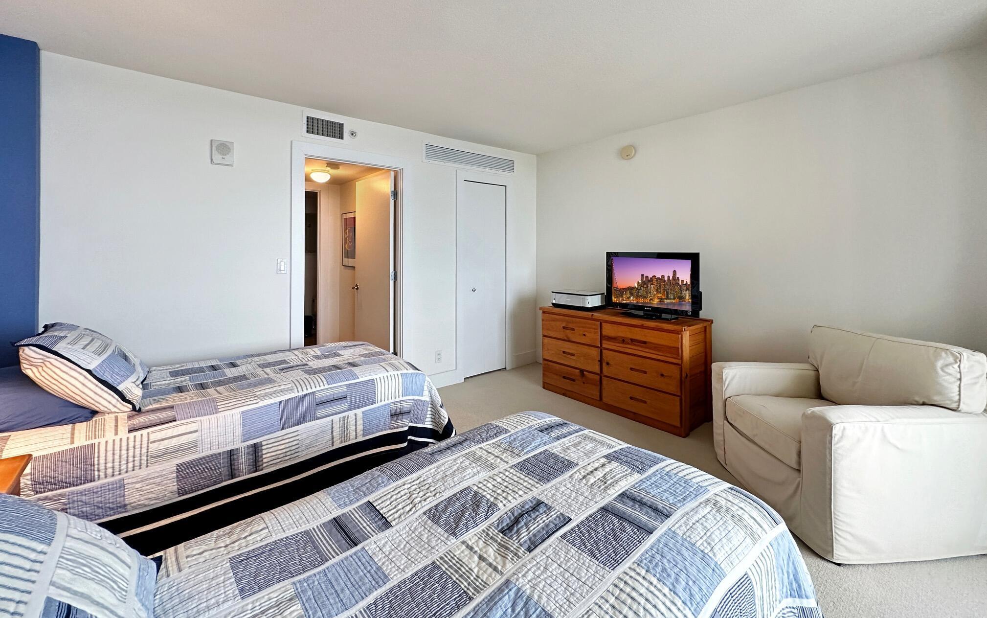 3000 North Ocean Drive, Unit 22D Riviera Beach, FL 33404 - Photo 13 of 53 a bedroom with a bed and dresser