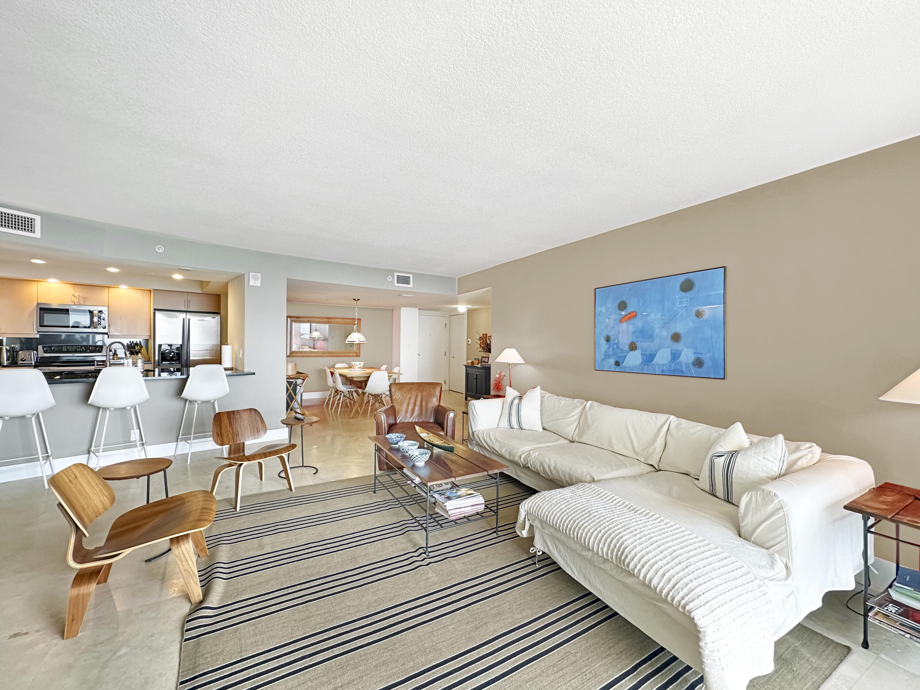 3000 North Ocean Drive, Unit 22D Riviera Beach, FL 33404 - Photo 3 of 53 a living room with furniture and kitchen view