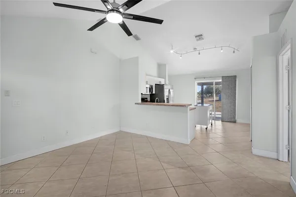 a view of a kitchen with a sink and dishwasher cabinets