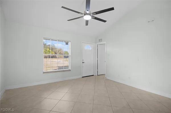 a view of an empty room with a window