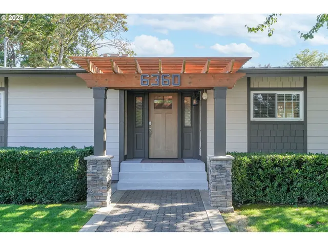 a front view of a house with garden